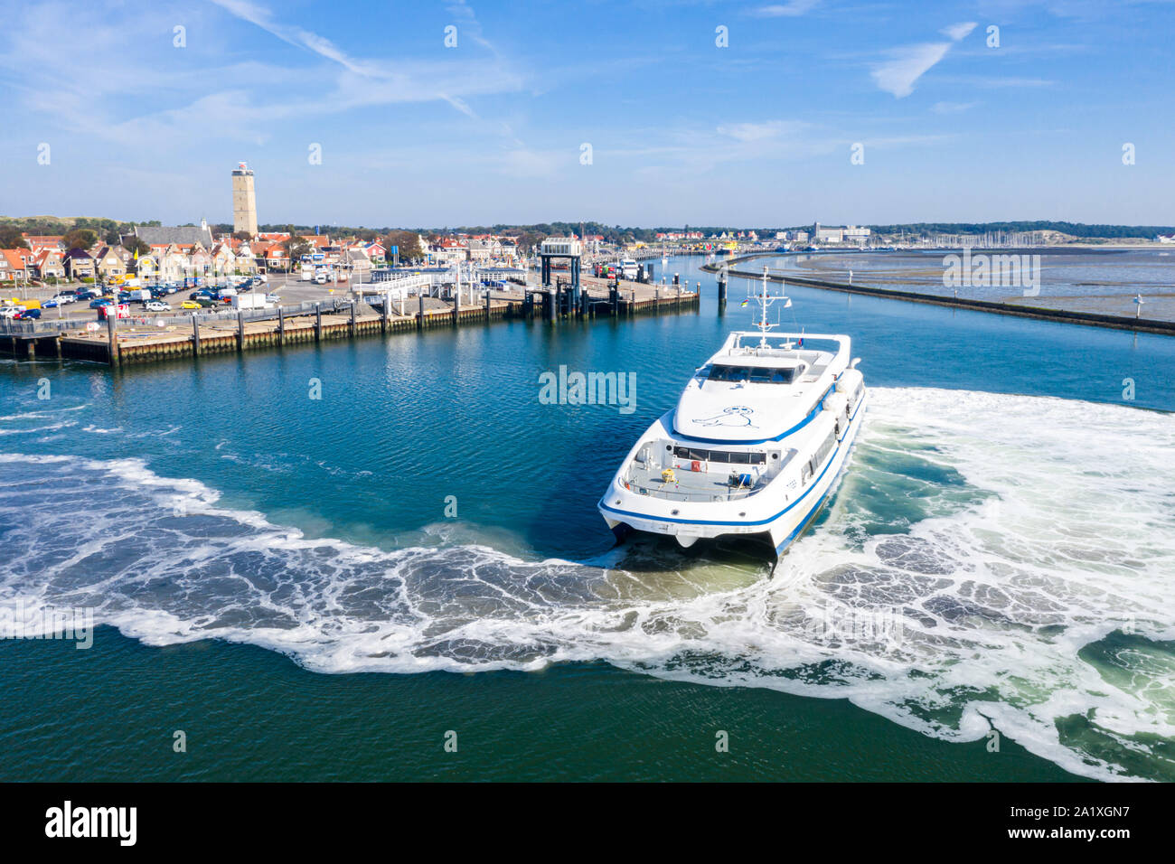 Netherlands, Terschelling - Aug 25, 2019: Catamaran MS Tiger leaves harbour of West-Terschelling, West Frisian Islands on its way to Dutch port of Har Stock Photo