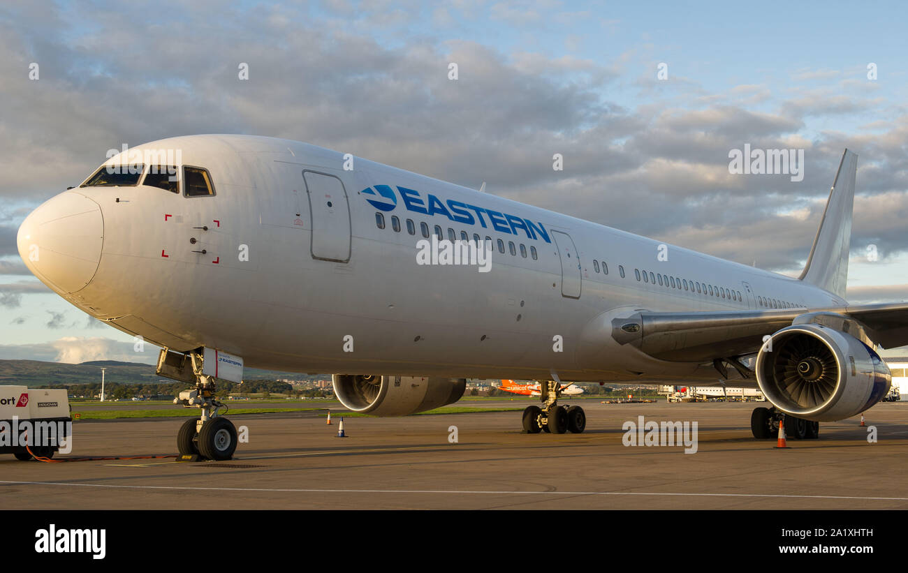 Glasgow, UK. 28 September 2019.  Pictured: Eastern Boeing 767-300 the tarmac after just landing. Following the immediate fallout from the collapsed tour company Thomas Cook, Operation Matterhorn is still in full swing at Glasgow Airport. The grounded and impounded Thomas Cook aircraft have been moved to a quieter part of the airfield to make way for the wide body fleet needed for operation Matterhorn. Colin Fisher/CDFIMAGES.COM Stock Photo