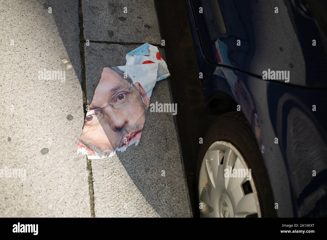 Ripped campaign poster torn up on the street during the Austrian Elections September 2019 of Herbert Kickl of the Freedom Party of Austria/FPÖ Stock Photo