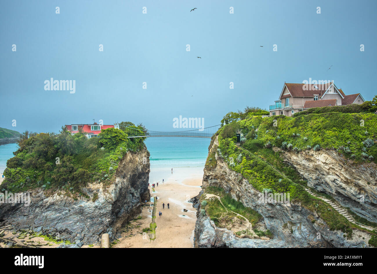 The House in the sea is a property accessed across a suspension bridge on Towan beach at Newquay in Cornwall, England, UK. Stock Photo