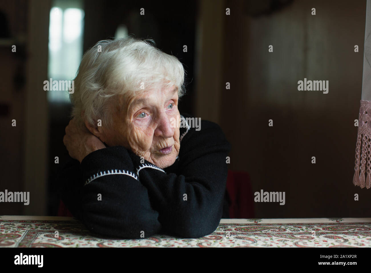 Elderly woman at home. Taking care of lonely old pensioners. Stock Photo