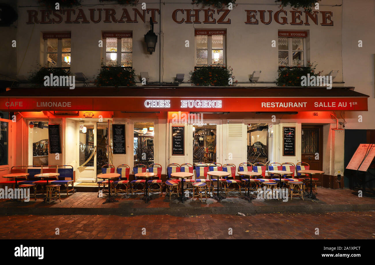 The famous Cafe Chez Eugene at night . It is located in the Montmartre, Paris, France. Stock Photo