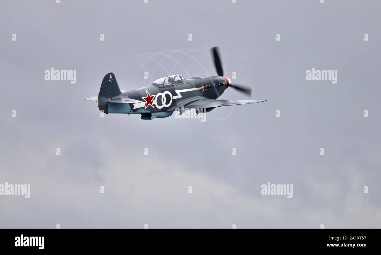 Yakovlev Yak-3UA taking off at the Battle of Britain airshow at Duxford on the 22 September 2019 producing propeller tip vortex condensation Stock Photo