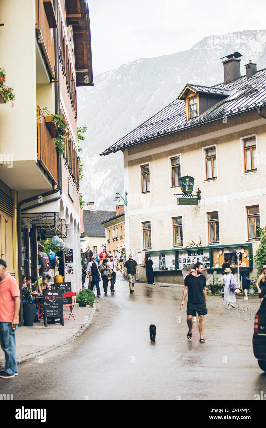 Hallstatt, Austria - June 15, 2019: view of tourist city street overloaded with people Stock Photo