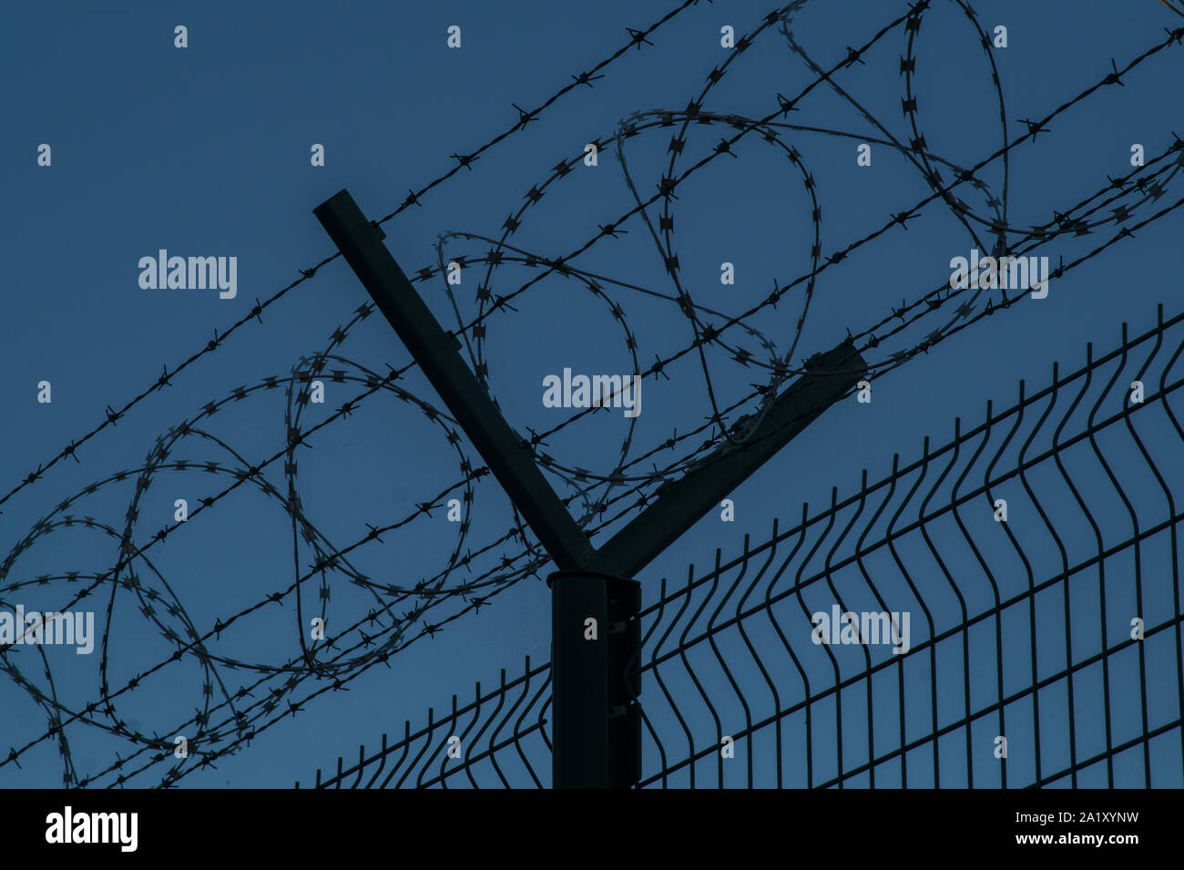 Barbed wire steel fence against the immigrants in europe. Restricted