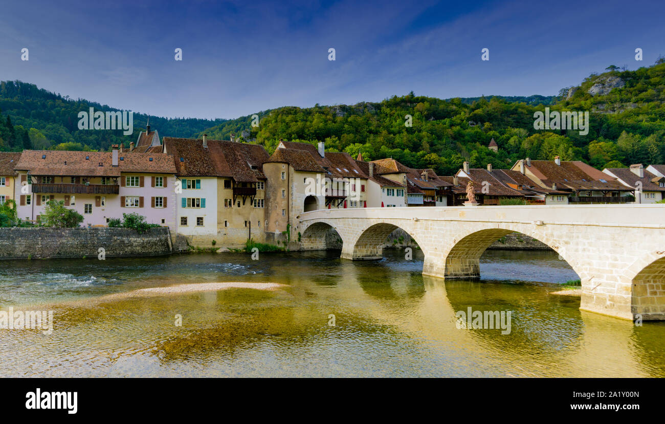 St. Ursanne, Jura / Switzerland - 27 August 2019: the historic and picturesque Swiss village of Saint-Ursanne on the Doubs River Stock Photo