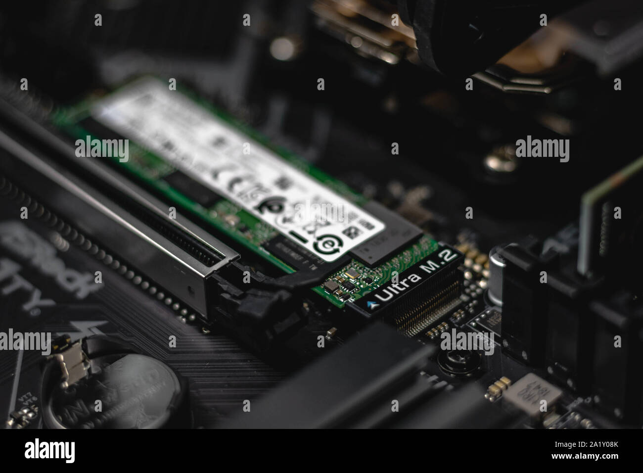 Ultra M.2 NVMe SSD Flash Drive mounted on a Mainboard/Motherboard Stock Photo