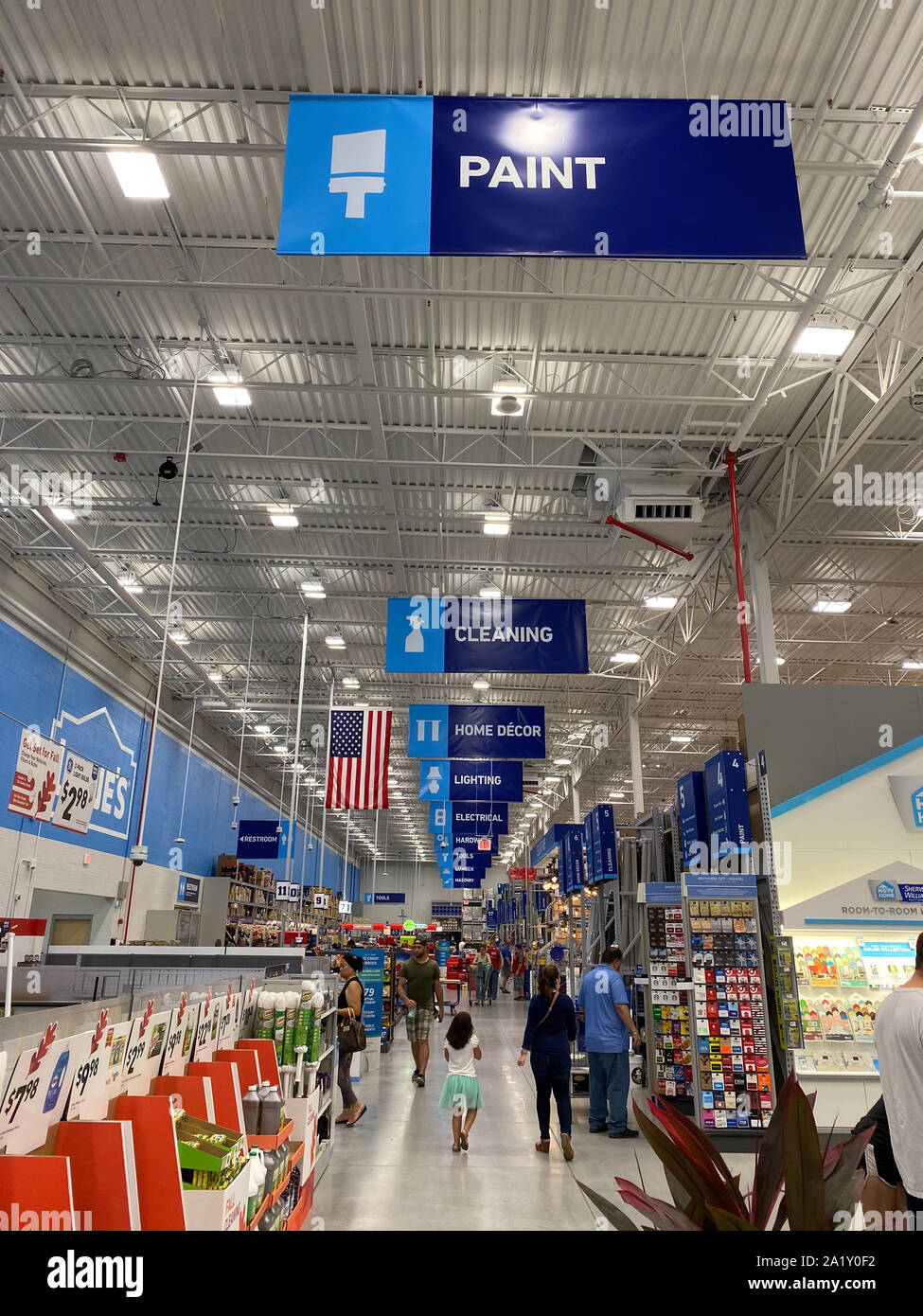 Orlando,FL/USA-9/28/19: The signs hanging from the ceiling at Lowes home improvement store that designate what departments are in the aisle while peop Stock Photo