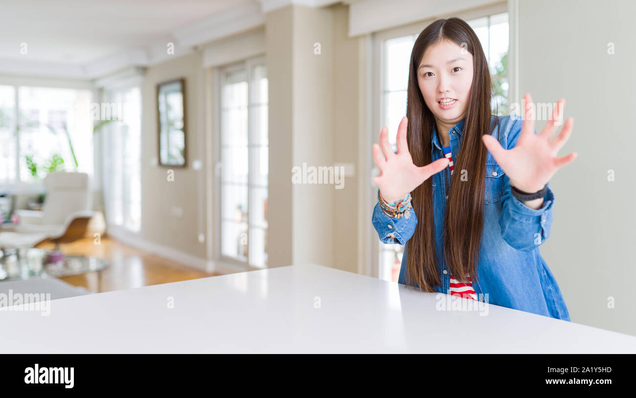 Young Beautiful Asian Woman With Long Hair Wearing Denim Jacket