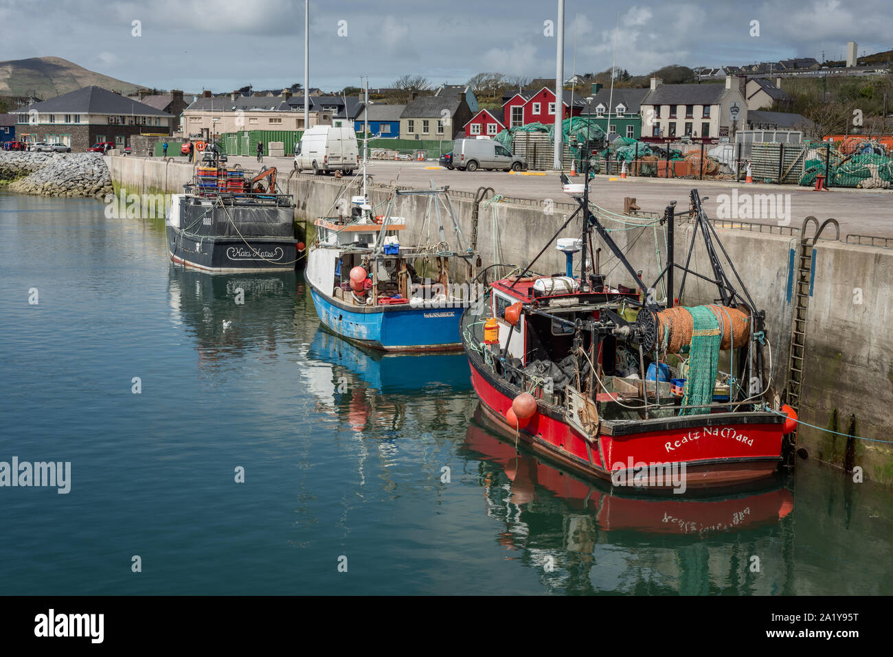 Docked fishing motorboats in Dingle harbour or harbor, Dingle, County Kerry, Ireland Stock Photo