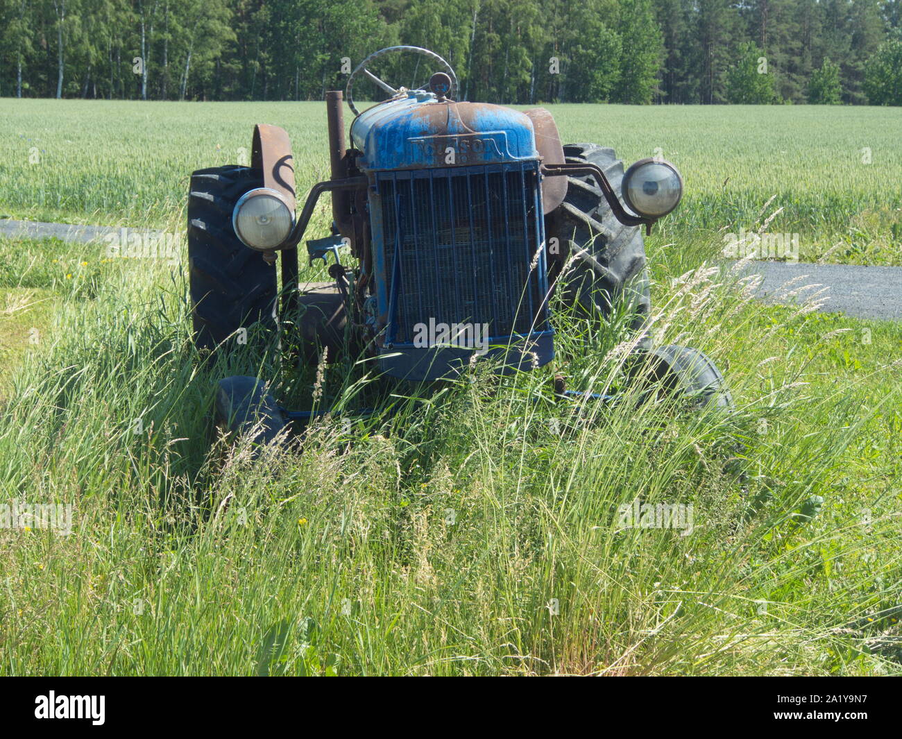 Old tractor at a Swedish field Stock Photo Alamy