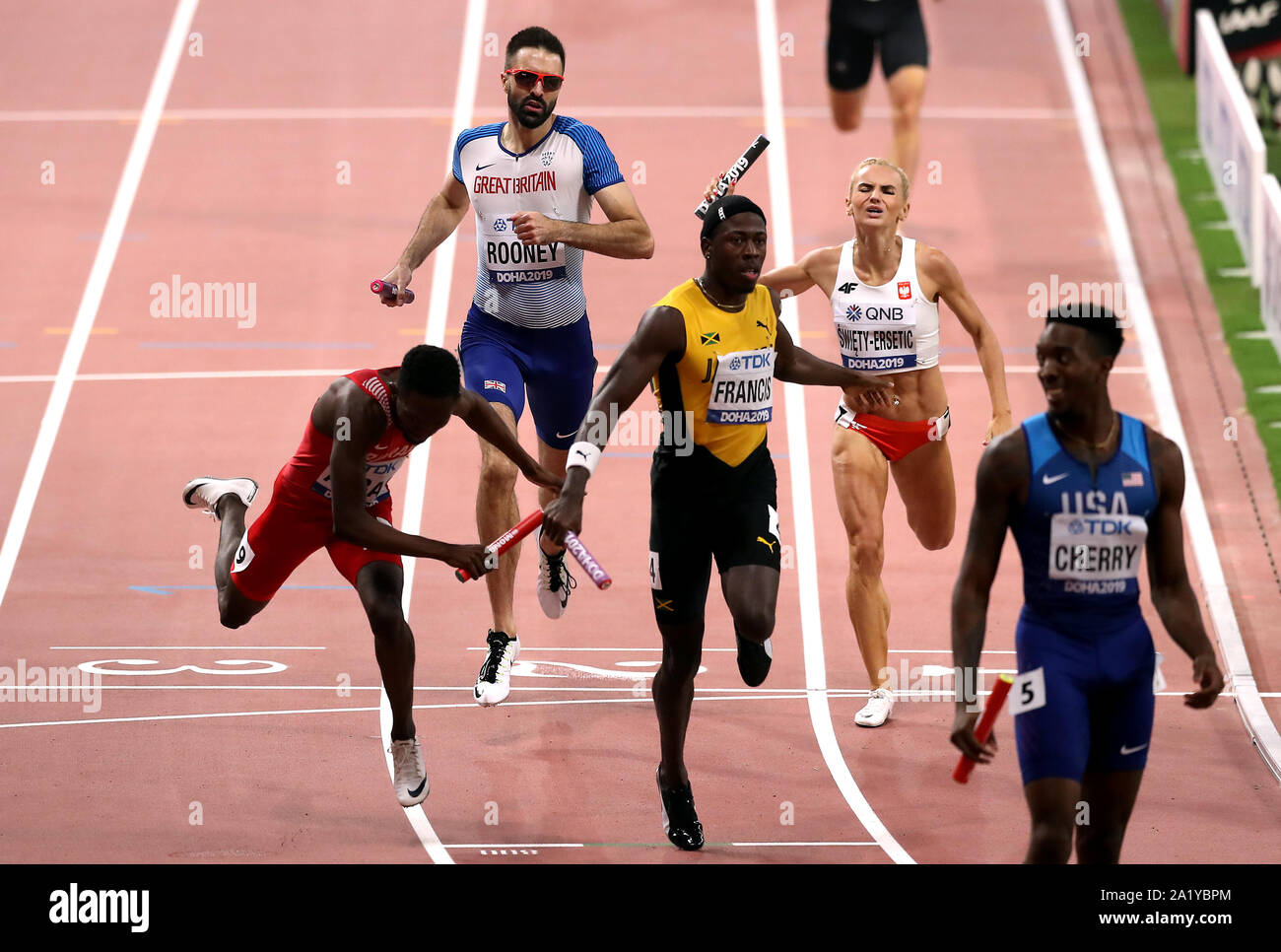 Great Britain’s Martyn Rooney crosses the line to lead home his team to fourth place in the Mixed 4x400m relay during day three of the IAAF World Championships at The Khalifa International Stadium, Doha, Qatar. Stock Photo