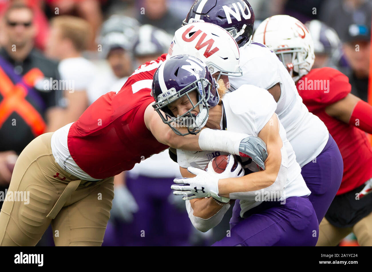 Madison, WI, USA. 28th Sep, 2019. Northwestern Wildcats running back Drake Anderson #6 is tackled by a Wisconsin defensive player during the NCAA Football game between the Northwestern Wildcats and the Wisconsin Badgers at Camp Randall Stadium in Madison, WI. Wisconsin defeated Northwestern 24-15. John Fisher/CSM/Alamy Live News Stock Photo