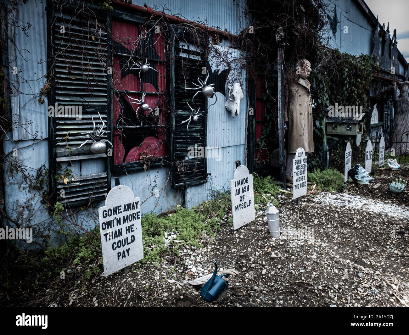 Funny Halloween decorations in front of a haunted house Stock Photo