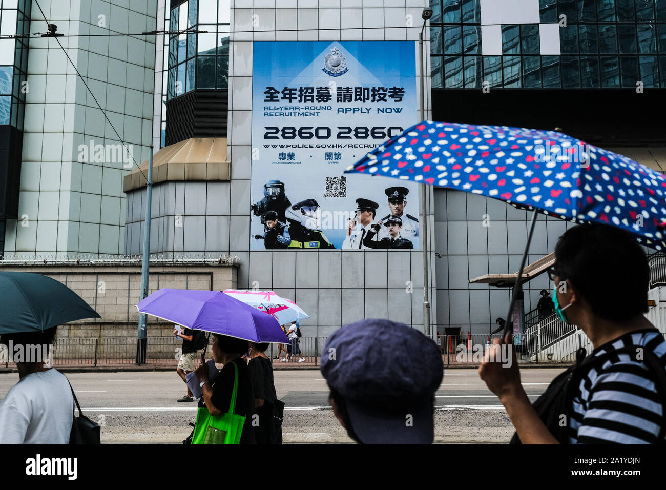 Protesters carry umbrellas during the demonstration.Protesters took