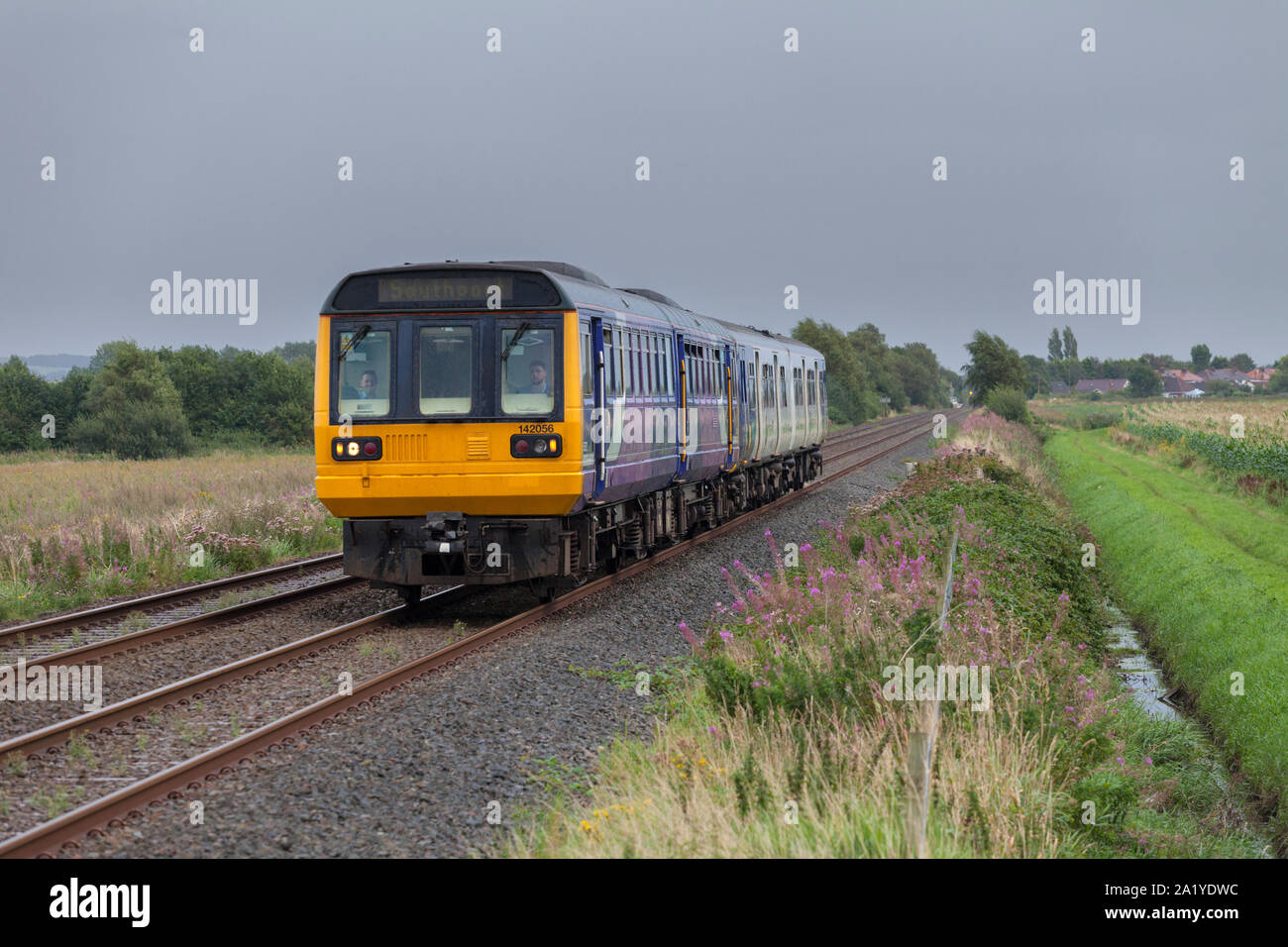 Arriva Northern rail class 142 pcer train + class 150 sprinter passing