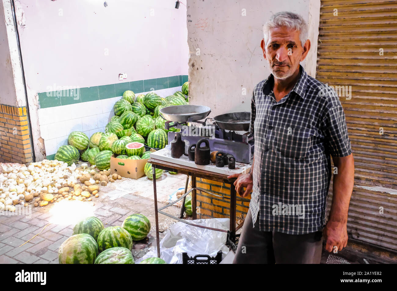 Man and shop with watermelons. Bazaar. Kashan, Iran. Asia. Stock Photo