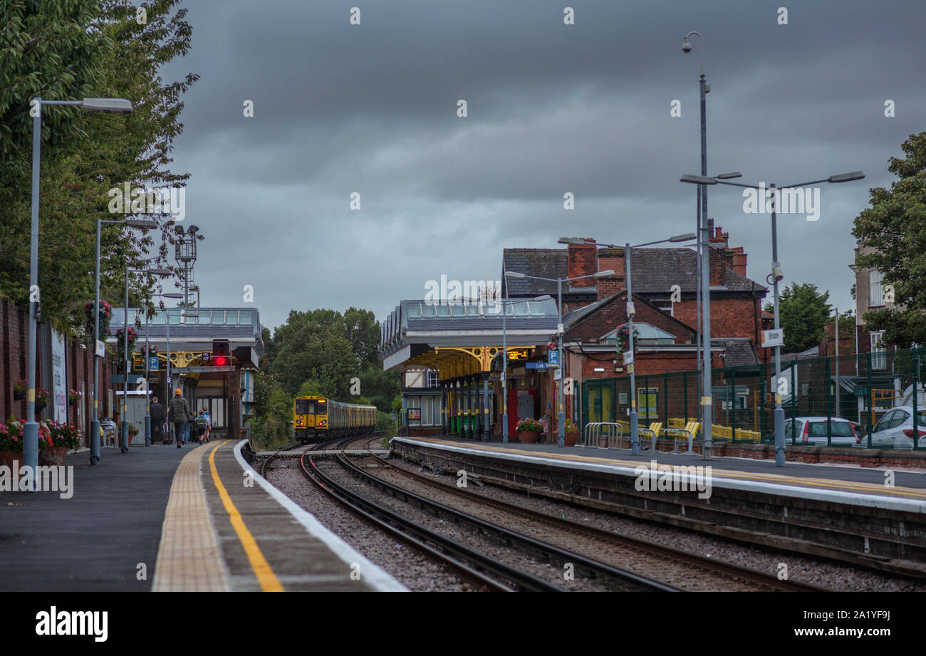 Merseyrail class 508 electric train departing from Birkdale railway