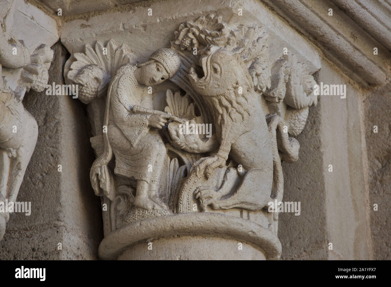Saint Jerome and the Lion depicted in the Romanesque capital dated from the 12th century on the west portal of the Autun Cathedral (Cathédrale Saint-Lazare d'Autun) in Autun, Burgundy, France. The capital was probably carved by French Romanesque sculptor Gislebertus. Stock Photo