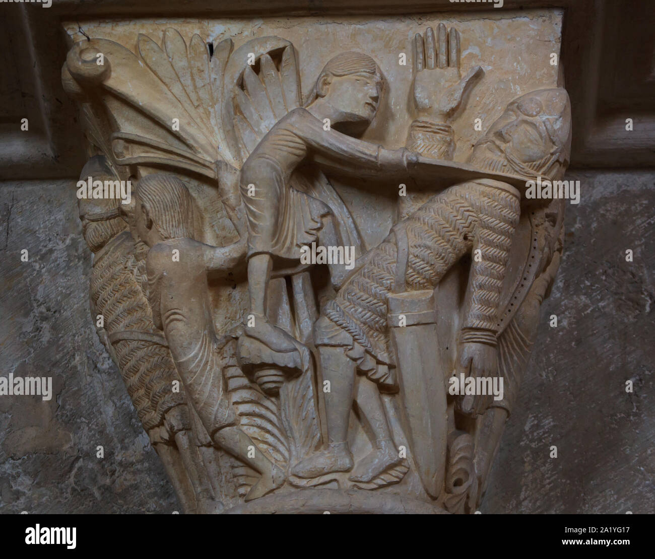 David slaying Goliath depicted in the Romanesque capital dated from the 12th century in the Basilica of Saint Mary Magdalene (Basilique Sainte-Marie-Madeleine de Vézelay) of the Vézelay Abbey (Abbaye Sainte-Marie-Madeleine de Vézelay) in Vézelay, Burgundy, France. Stock Photo