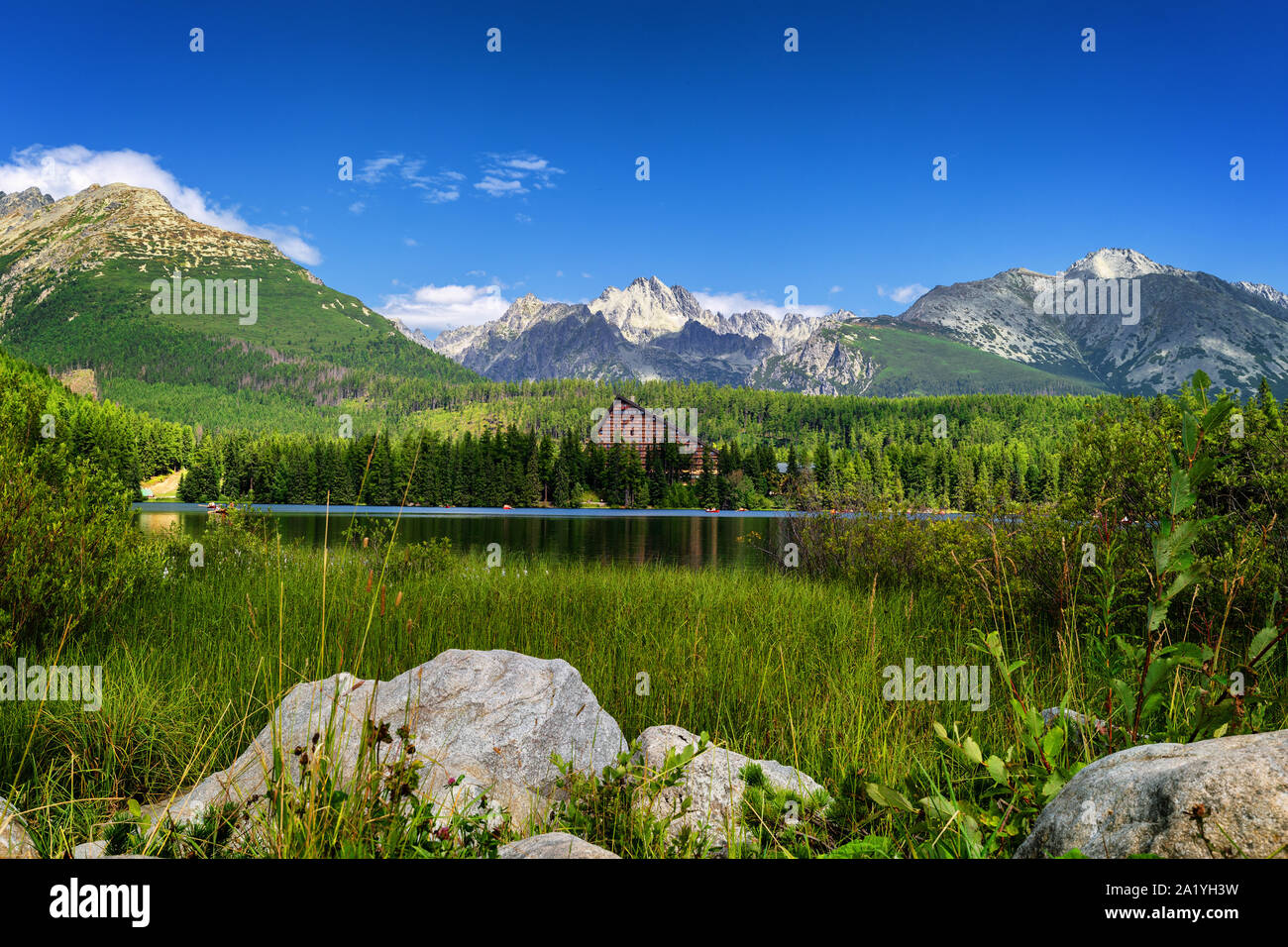 Strbske pleso. High tatras mountains. Vysoke tatry. Autumn forest. Reflection in lake. Beautiful landscape. Slovakia. Hotel Patria Stock Photo