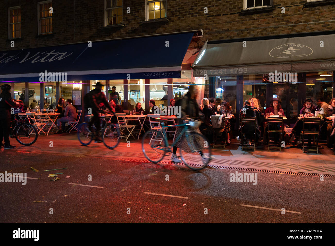 night scene of restaurants in Broadway Market, London Stock Photo