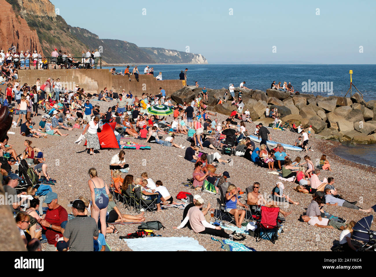 Sidmouth beach and seafront, packed with holidaymakers Stock Photo