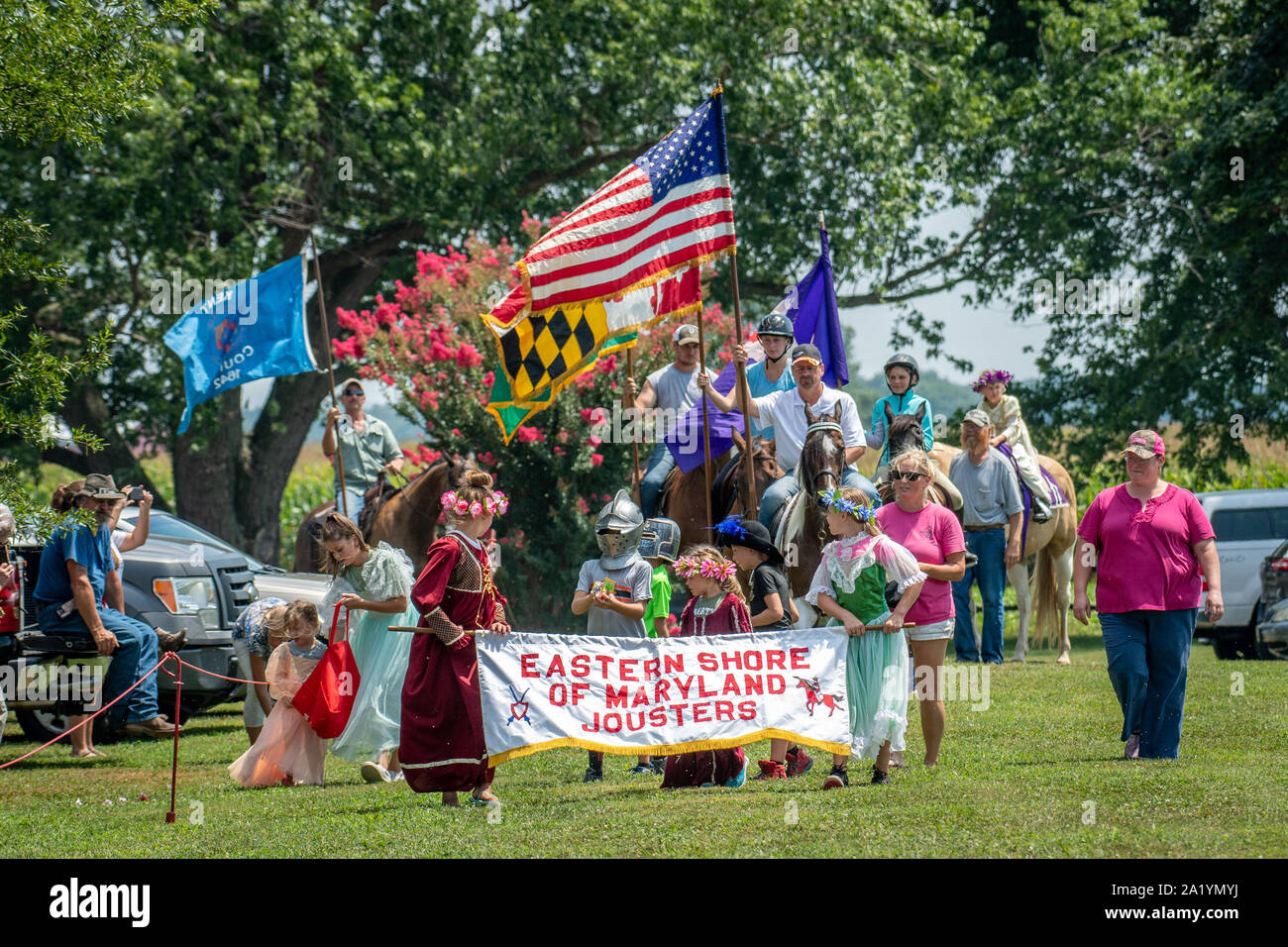 The procession of flags and riders before the Old St. Joseph's church jousting tournament