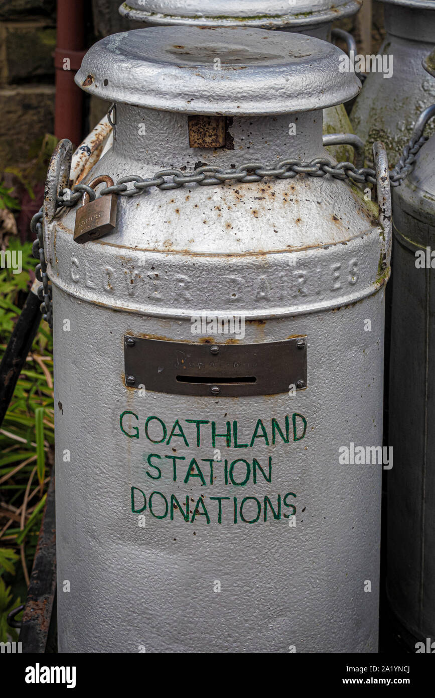 Goathland station, donation box created from old milk churn, North Yorkshire Moors Railway, UK. Stock Photo