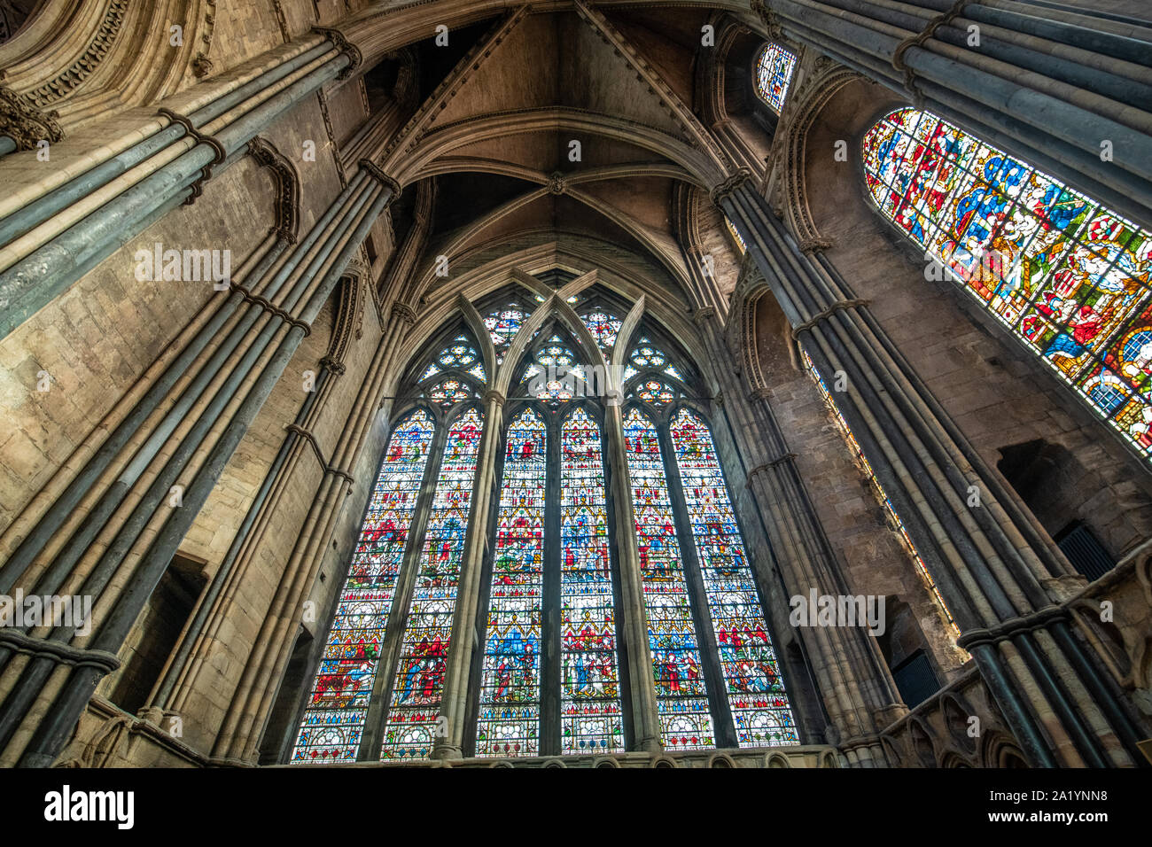 The colorful and detailed stained glass windows within Durham Cathedral