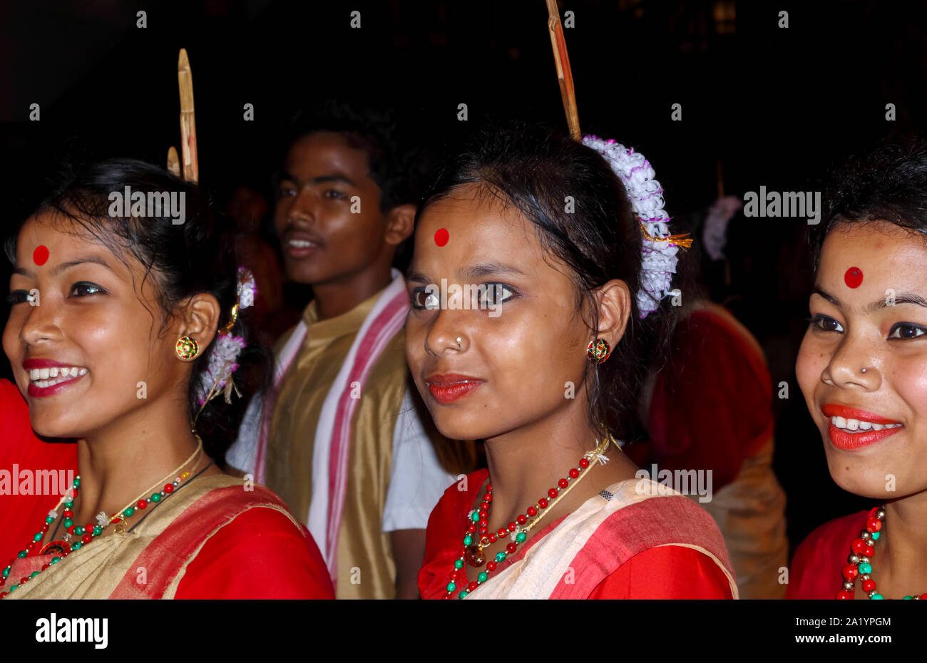 Smiling young local women dancers with bindis on their forehead at an Indian New Year dance in Kaziranga, Golaghat District, Bochagaon, Assam, India Stock Photo