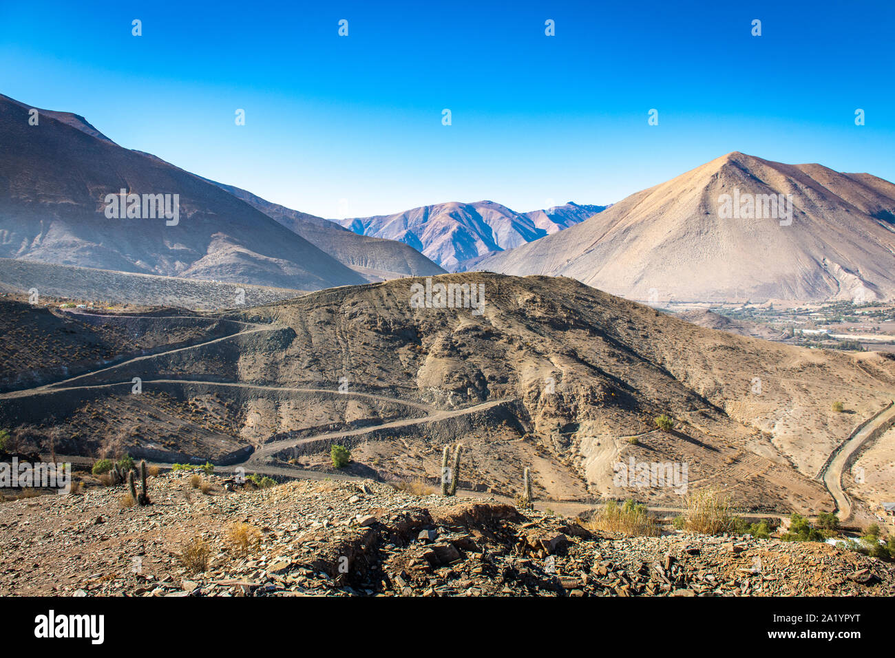 Roadways carved into the hillsides of Vicuna, Chile. Stock Photo