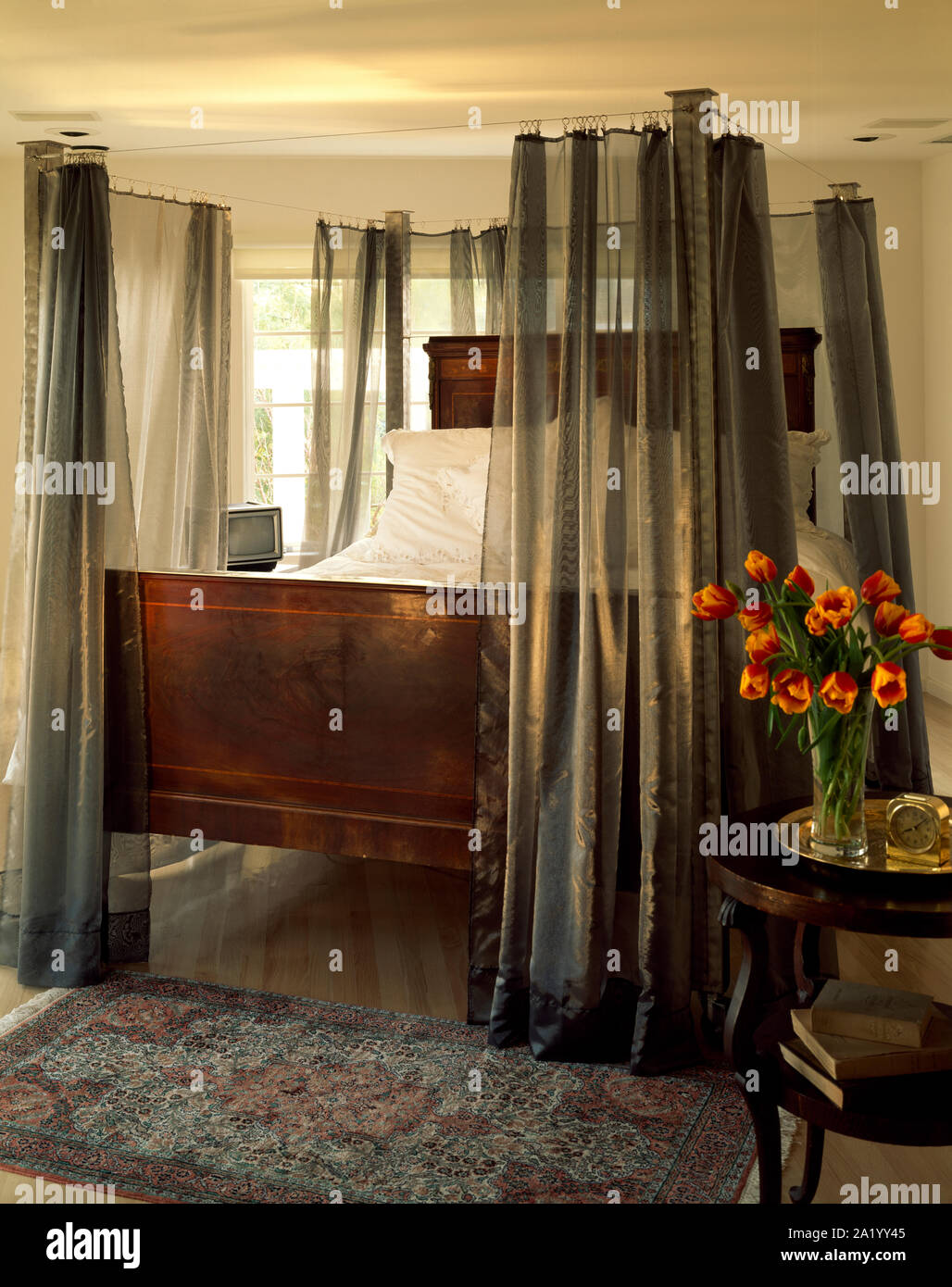 Double Bed With Sheer Gray Drapes Around Stock Photo 328225637