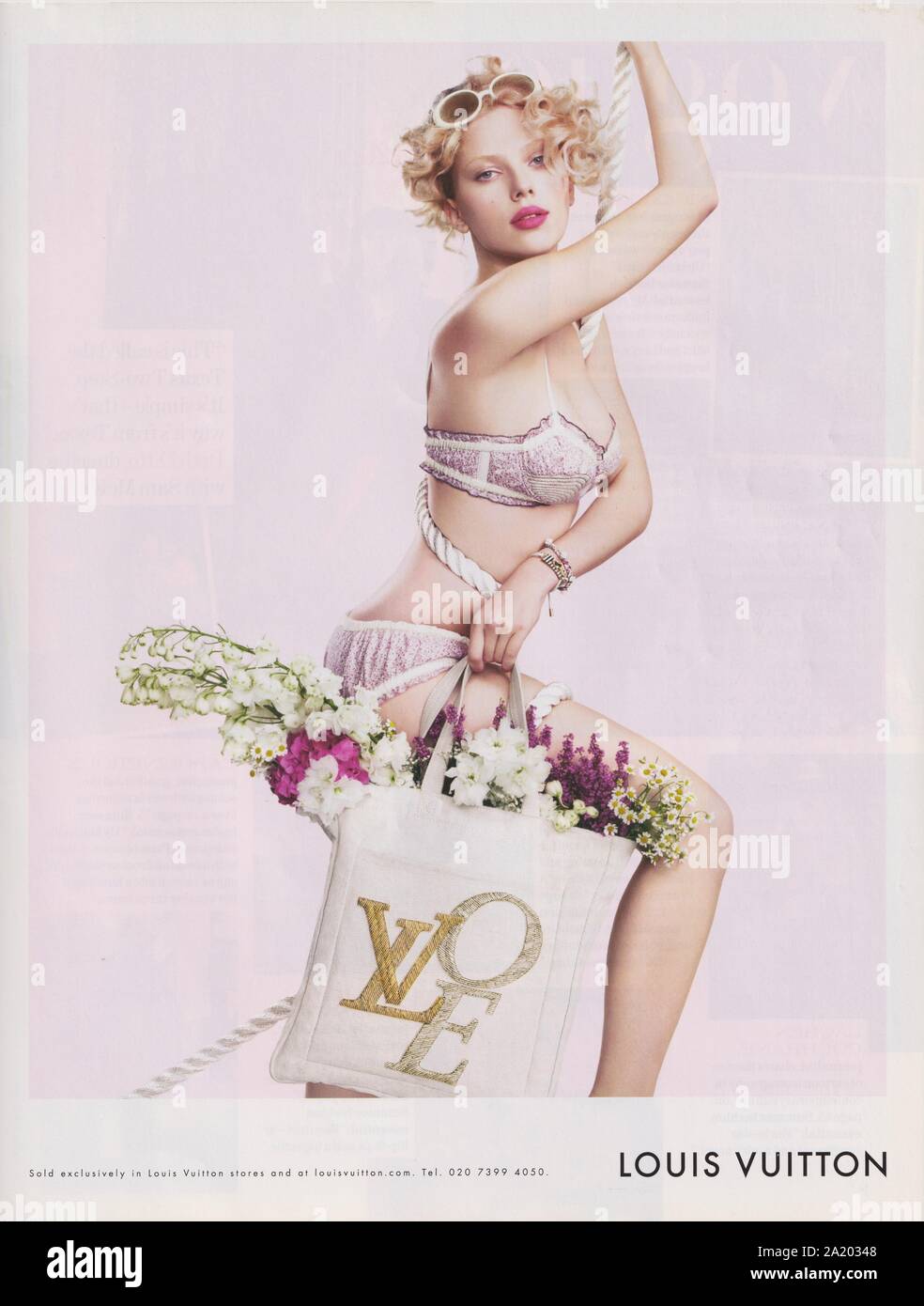 poster advertising Louis Vuitton handbag in paper magazine from 2014 year,  advertisement, creative LV Louis Vuitton advert from 2010s Stock Photo -  Alamy