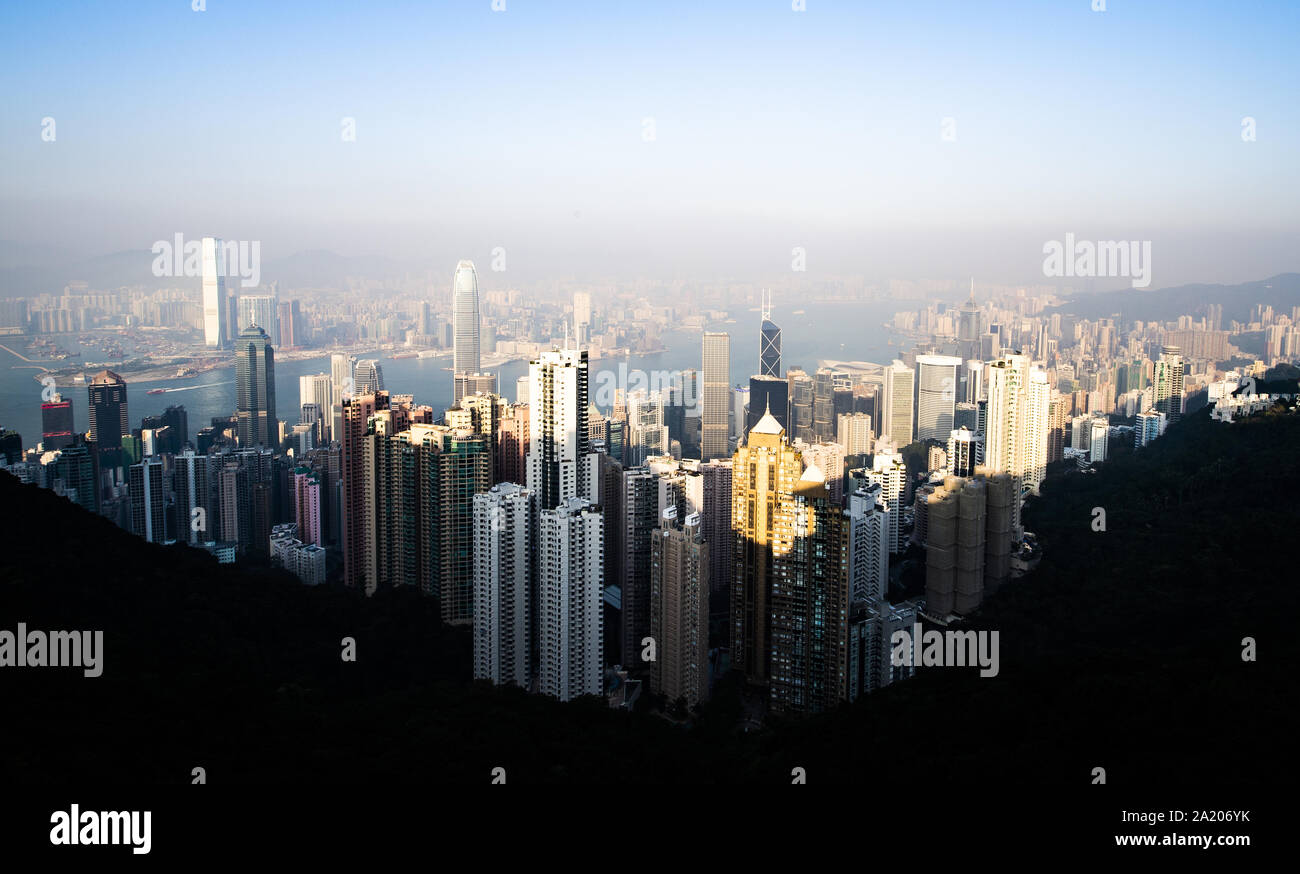 View from above, stunning view of the Hong Kong skyline during a beautiful sunset. Picture taken from the Victoria Peak. Stock Photo