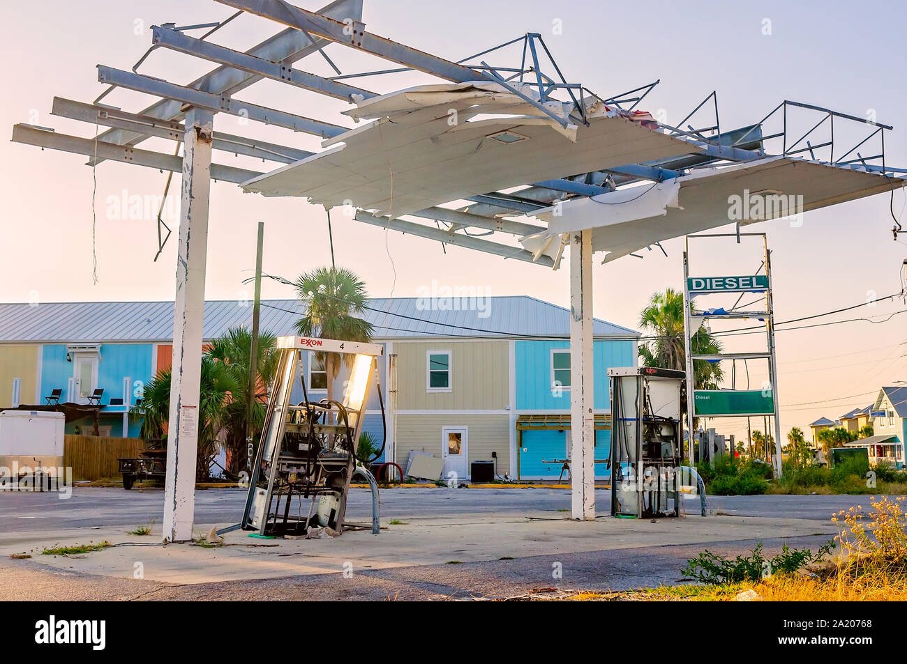 An Exxon gas station damaged by Hurricane Michael in 2018 remains standing, Sept. 27, 2019, in Mexico Beach, Florida. Stock Photo