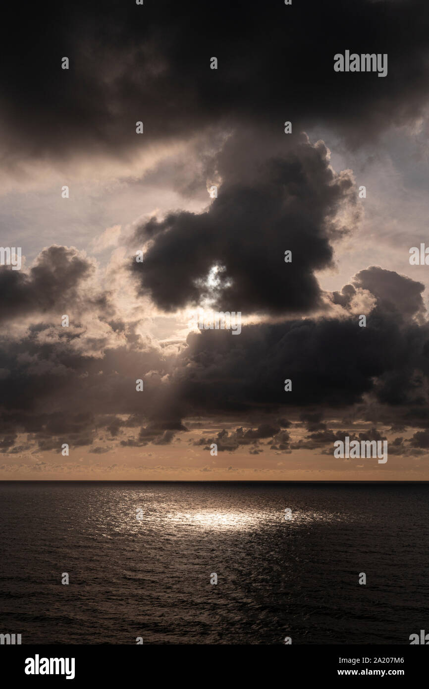 Clouds and sunlight over the Atlantic ocean at Widemouth Bay, Cornwall, England Stock Photo