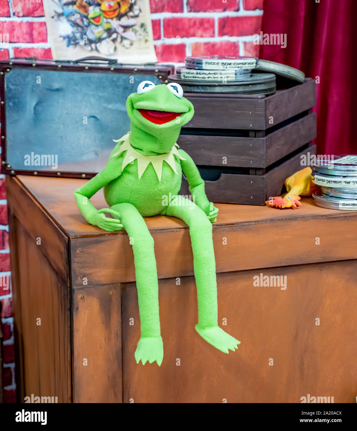 A talking Kermit the Frog puppet sat on a wooden box entertaining guest attending the annual Nor-Con movie and comic book convention Stock Photo