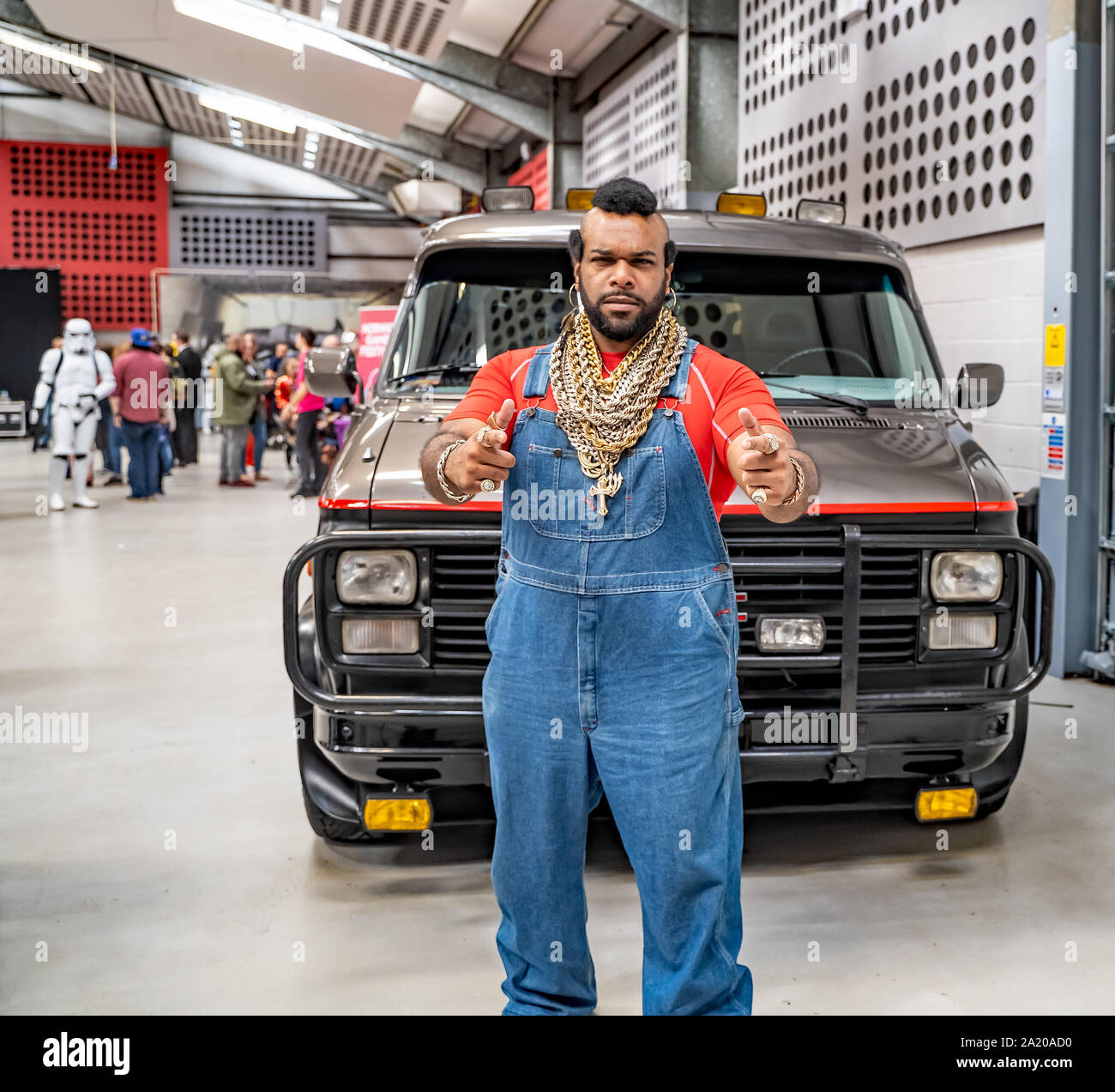A man in fancy dress costume as BA Baracus giving a thumbs up in front of a replica of the A Team van at the annual Nor-Con Stock Photo