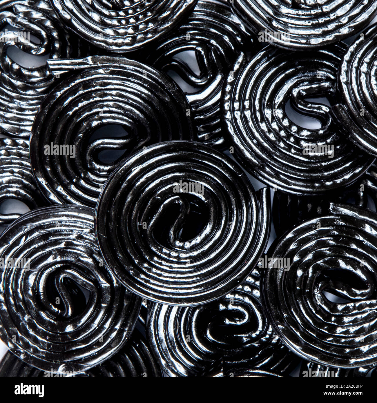 background of black licorice wheels Stock Photo - Alamy