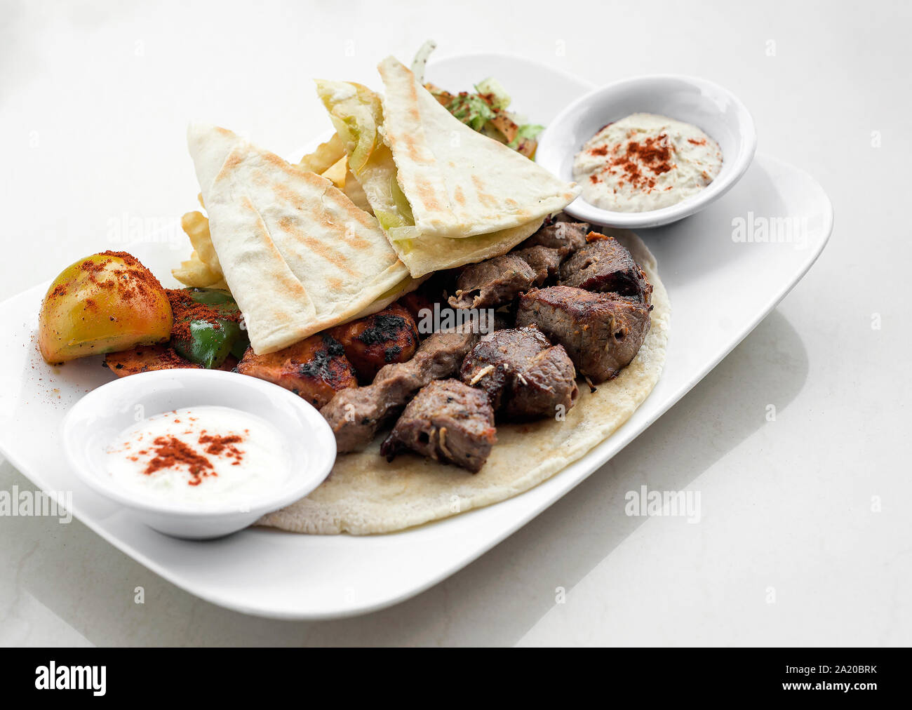 lebanese meshwi mixed bbq grilled meat set with chicken, lamb and beef in beirut restaurant Stock Photo