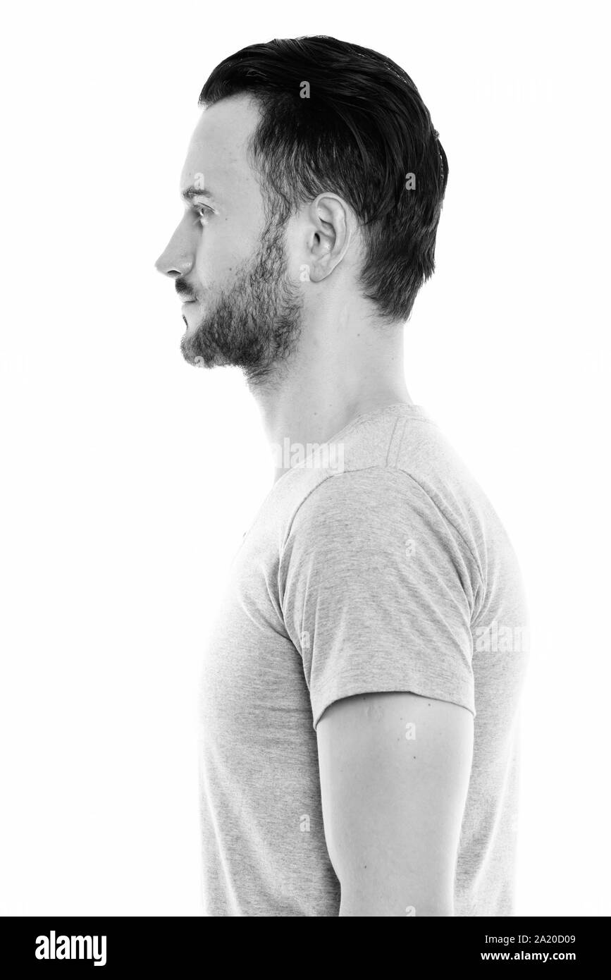 Studio portrait of young handsome man shot in black and white Stock Photo