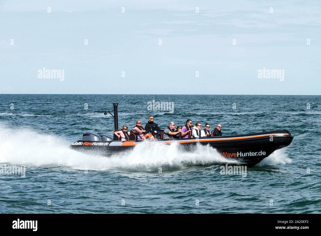 Tourists enjoying fast rides in an inflatable speedboat, Baltic Sea Rostock Germany tourists Europe enjoying travel experience, Powerboating Stock Photo