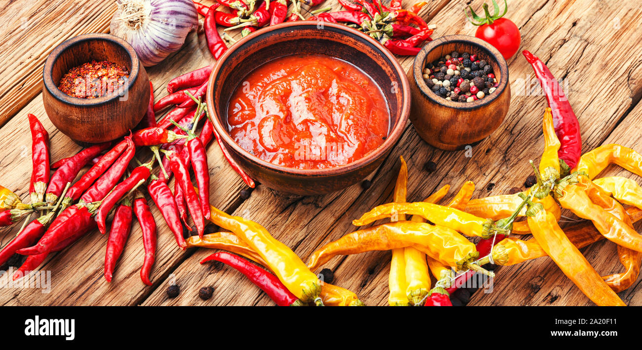 Spicy hot chili sauce with of chilli pepper Stock Photo - Alamy
