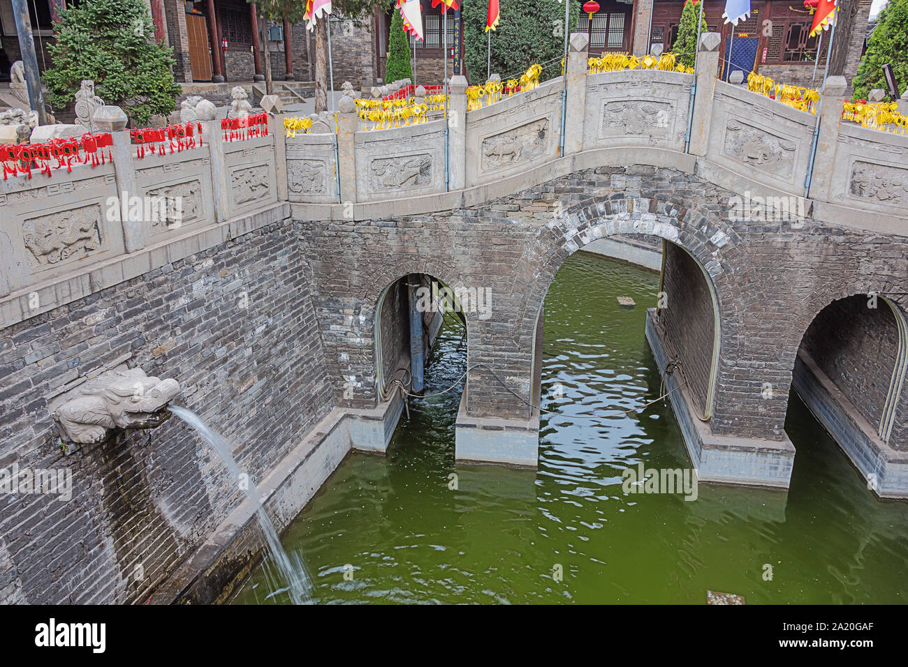 Entrance bridge in the Confucian temple complex in the old town of Pingyao Stock Photo