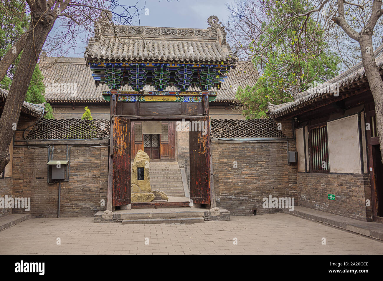 Gate to a courtyard in the Confucian temple complex in the old town of Pingyao Stock Photo