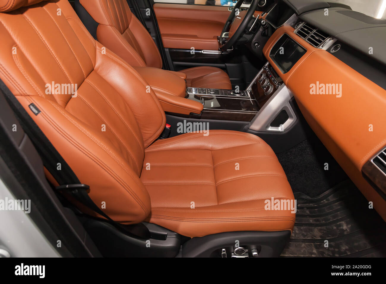 Novosibirsk, Russia - 08.01.2018: View to the white interior of Land Rover  Range Rover with dashboard, clock, media system, front seats and brown lea  Stock Photo - Alamy