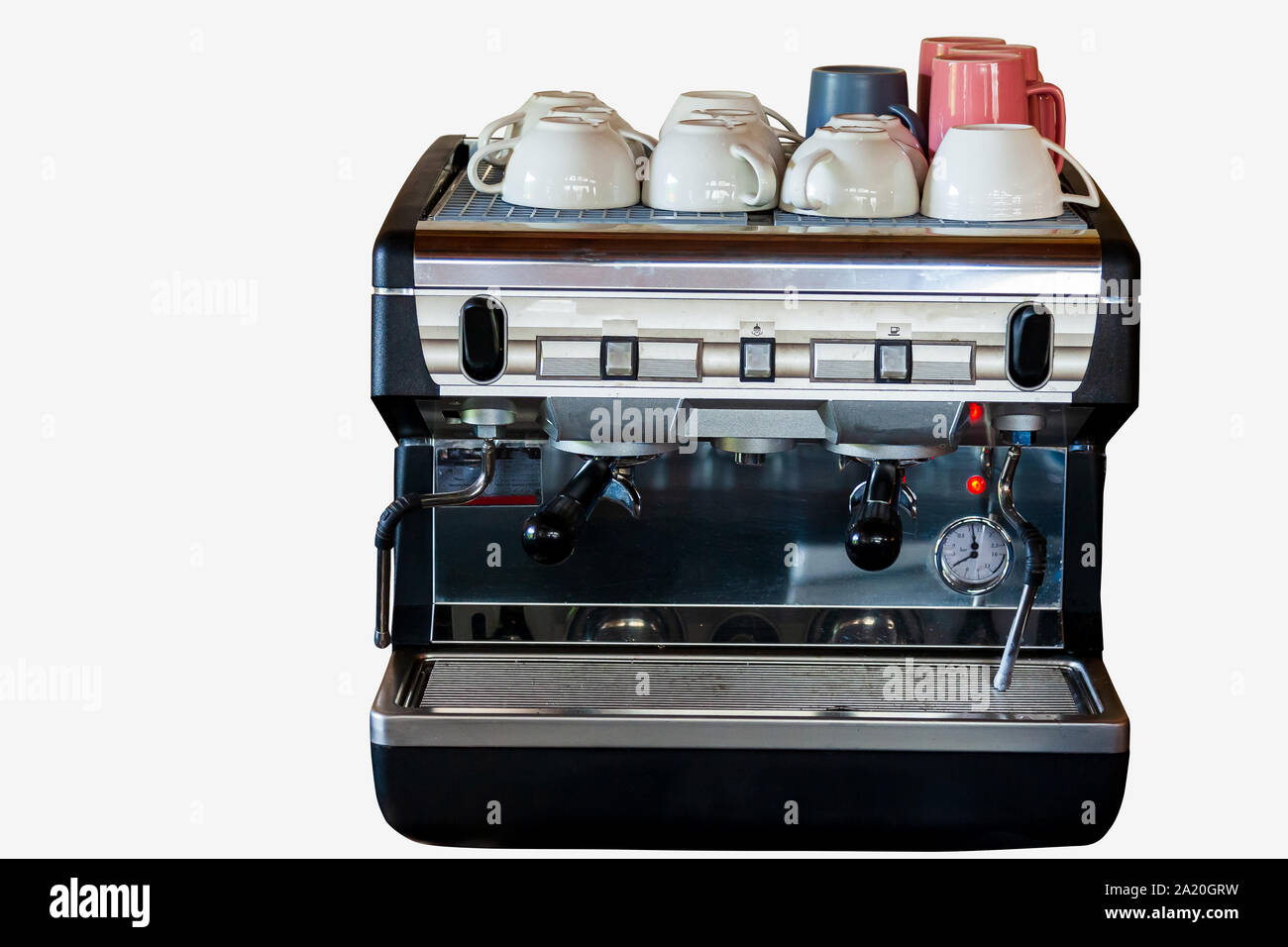 Electric coffee machine with mugs on top in a bar or cafe for making delicious drinks on white isolated background. Stock Photo