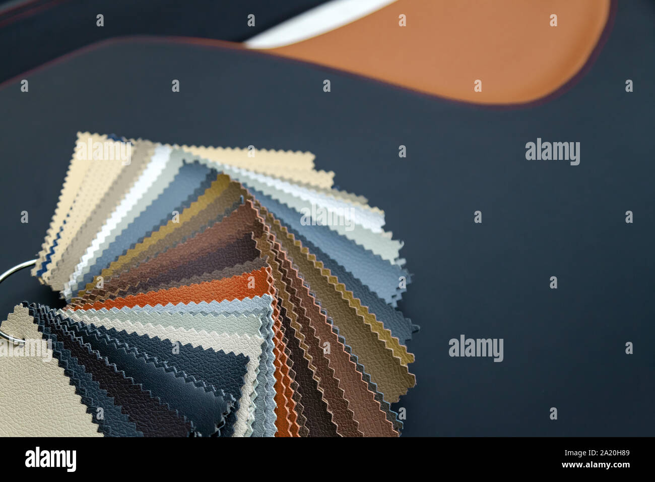 A catalog with samples of genuine leather materials in different colors