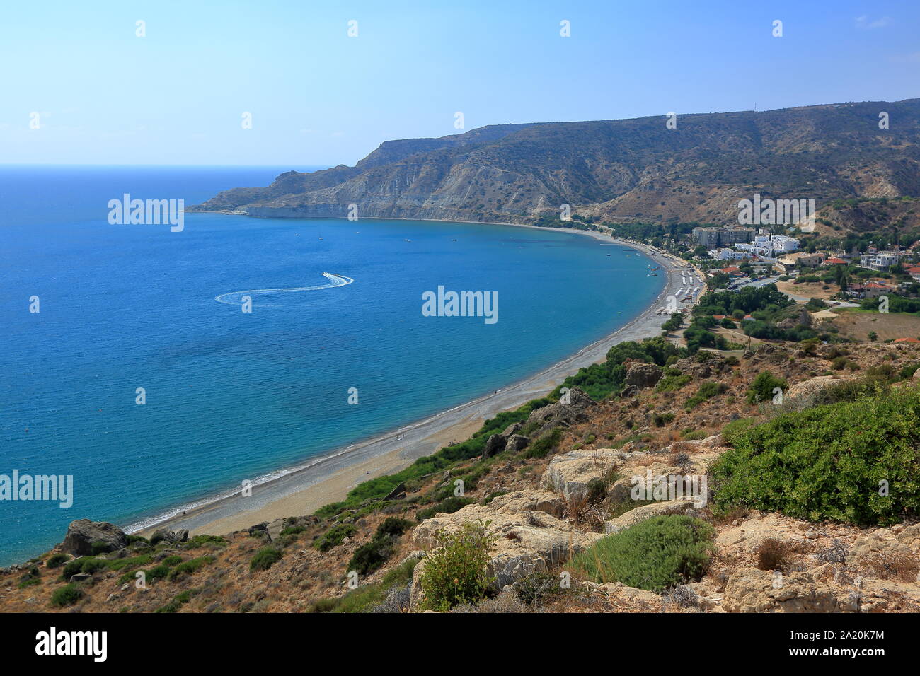 Beautiful landscape of Mediterranean sea bay and beach in Pissouri village, Cyprus, sand, arid hills surrounding area, seen from top of  point view. Stock Photo